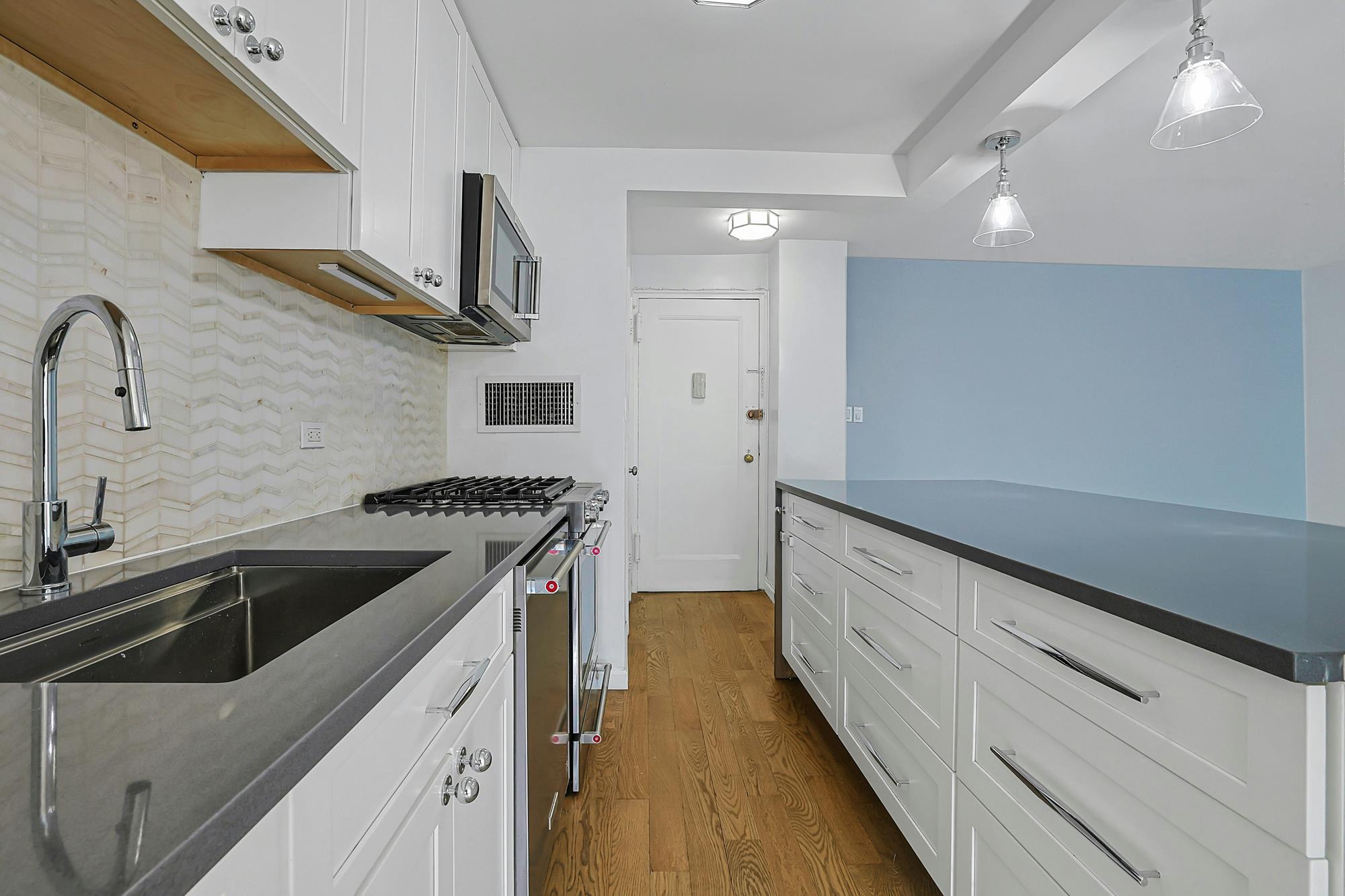 Bright & Renovated 2-Bd., 1.5-Bath Co-op with Balcony, 24-hr. Doormen & Indoor Parking at Briar Oaks
