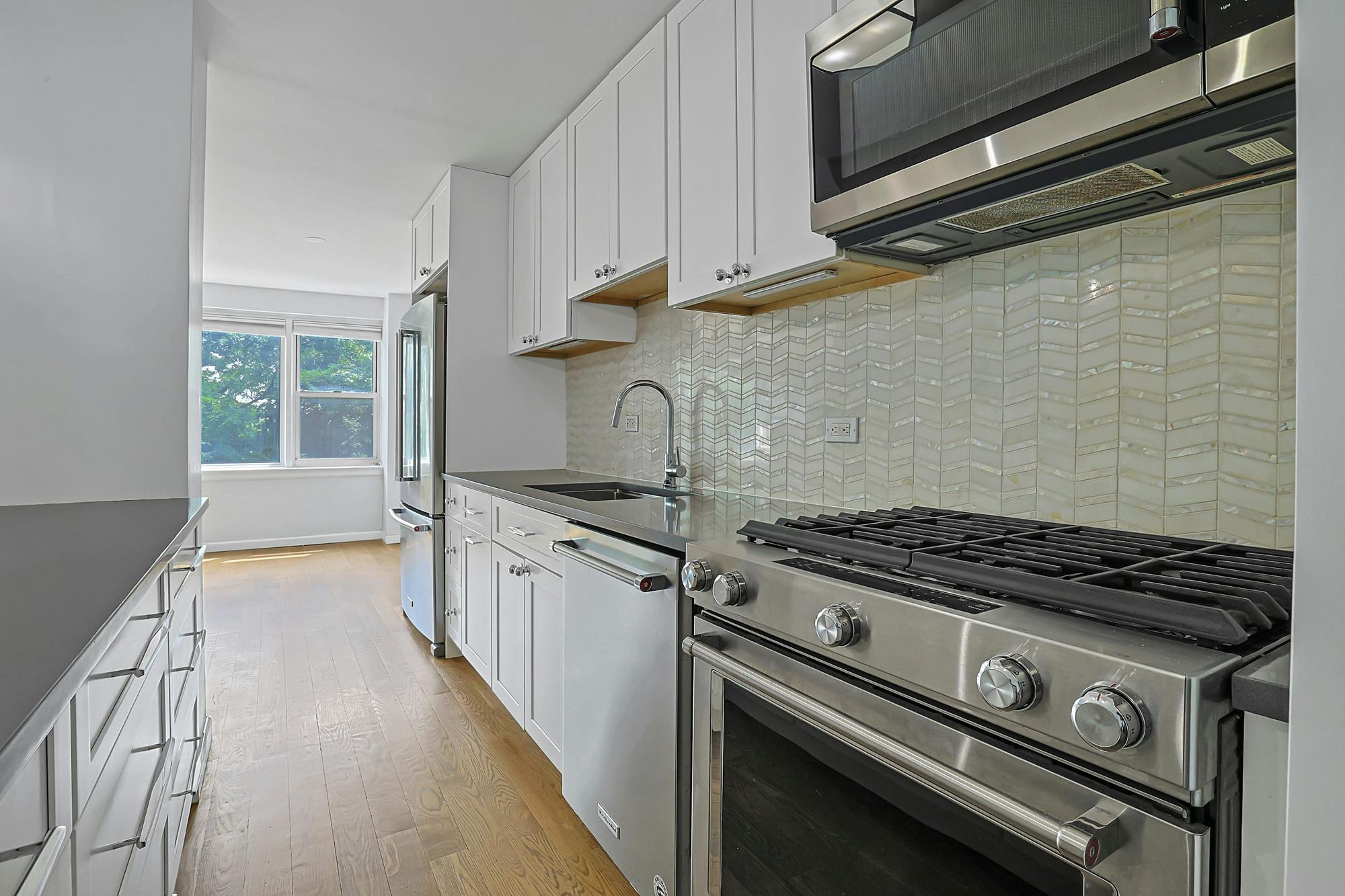 Bright & Renovated 2-Bd., 1.5-Bath Co-op with Balcony, 24-hr. Doormen & Indoor Parking at Briar Oaks