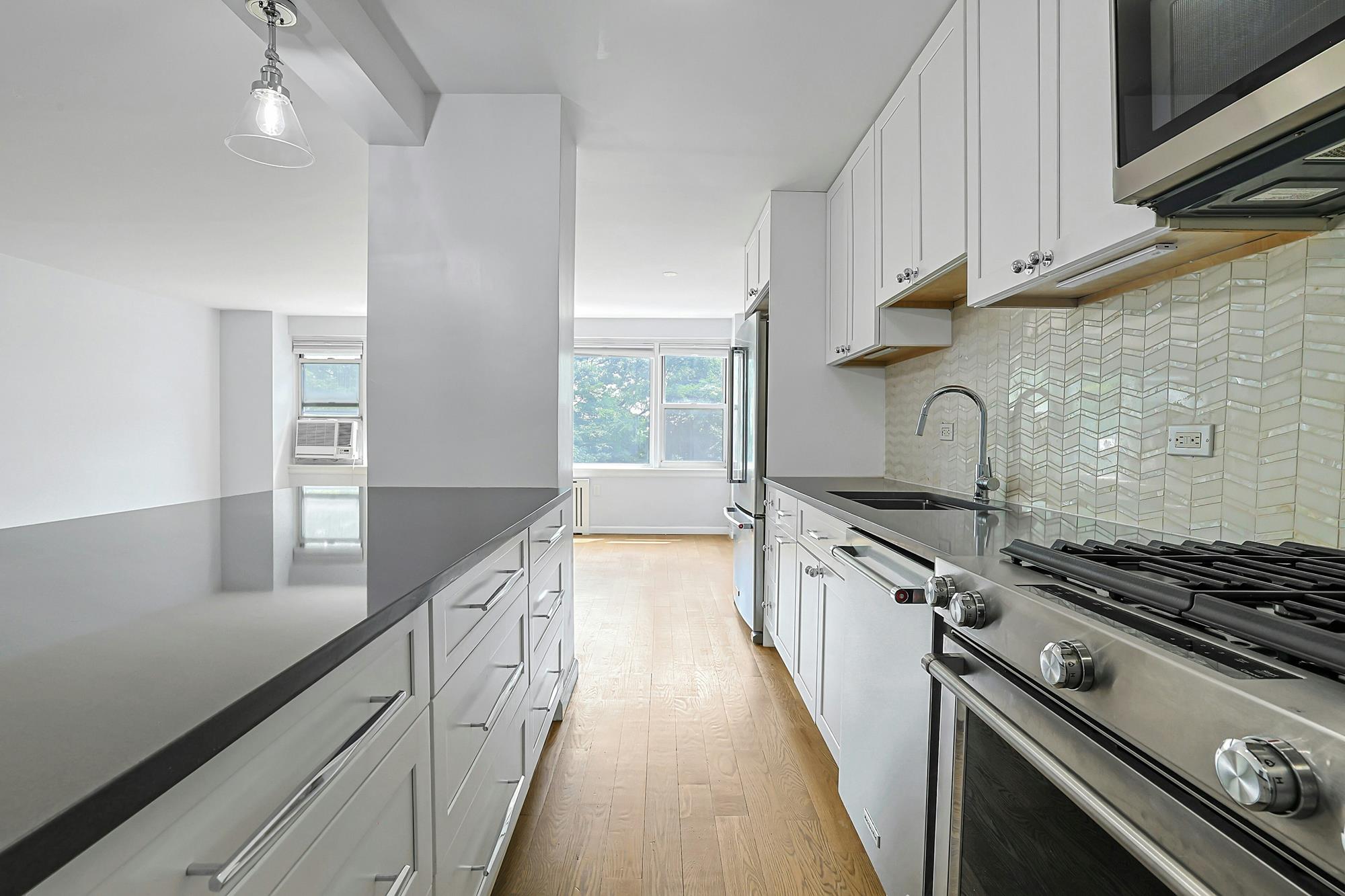 Bright & Renovated 2-Bd., 1.5-Bath Co-op with Balcony, 24-hr. Doormen & Indoor Parking at Briar Oaks
