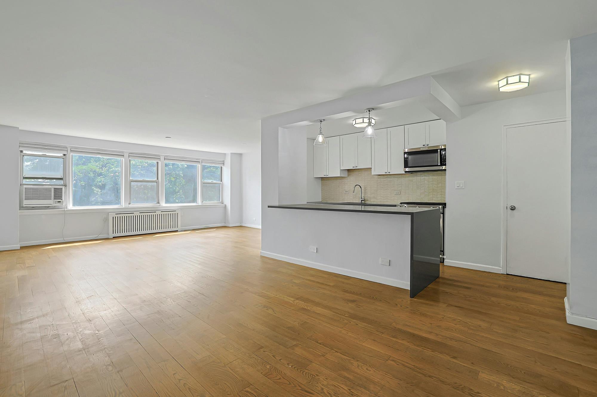 Bright & Renovated 2-Bd., 1.5-Bath Co-op with Balcony, 24-hr. Doormen & Indoor Parking at Briar Oaks