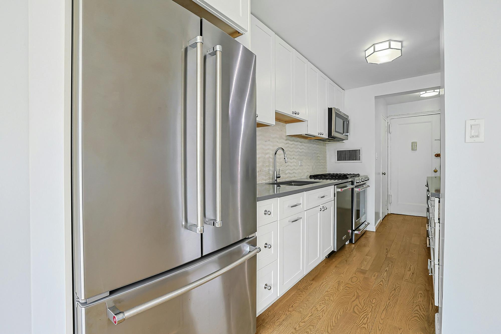 Bright & Renovated 2-Bd., 1.5-Bath Co-op with Balcony, 24-hr. Doormen & Indoor Parking at Briar Oaks