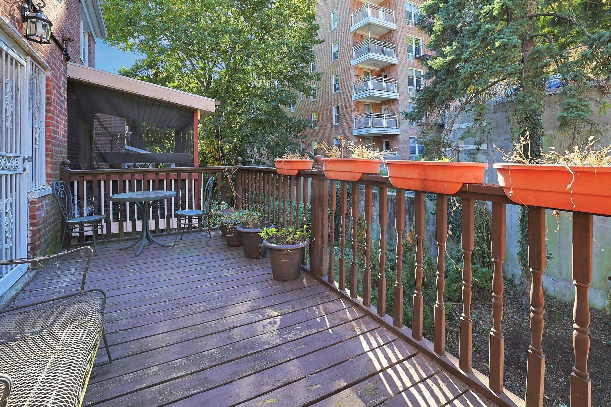 Spacious 3-Bd. Brick Townhouse with Deck & Yard on a Quiet, Tree-Lined Street
