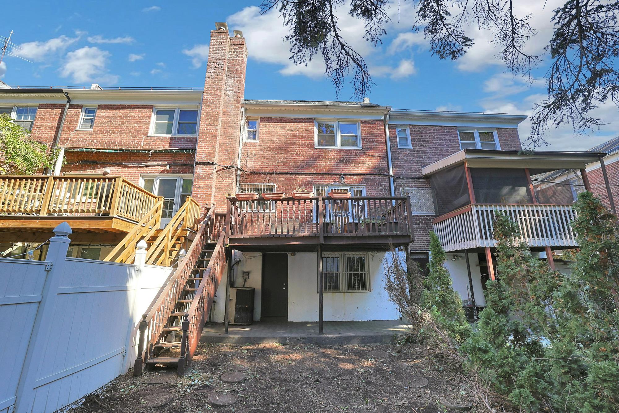 Spacious 3-Bd. Brick Townhouse with Deck & Yard on a Quiet, Tree-Lined Street