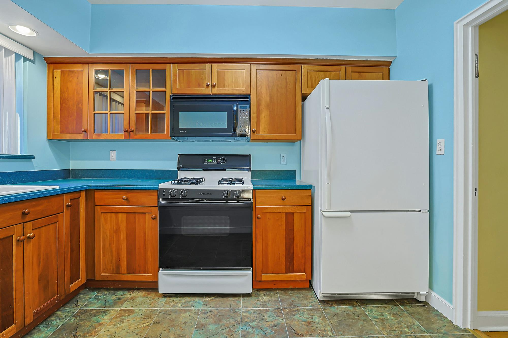 Spacious 3-Bd. Brick Townhouse with Deck & Yard on a Quiet, Tree-Lined Street