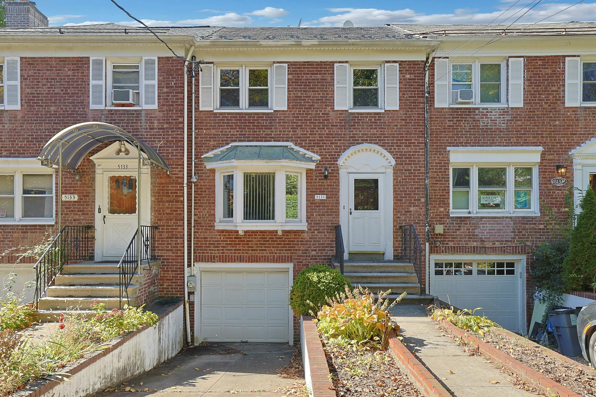 Spacious 3-Bd. Brick Townhouse with Deck & Yard on a Quiet, Tree-Lined Street