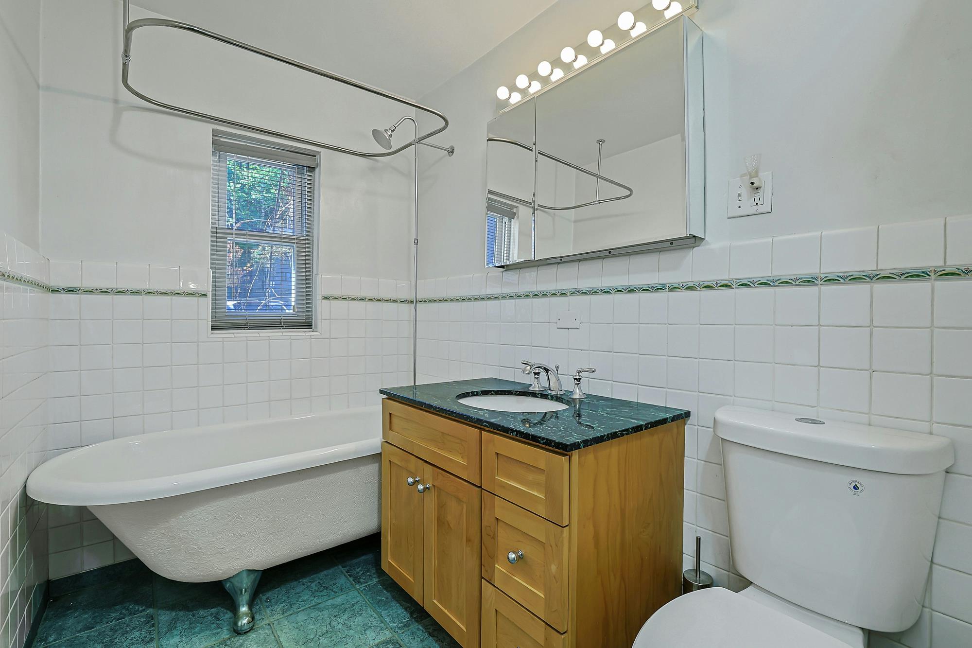 Spacious 3-Bd. Brick Townhouse with Deck & Yard on a Quiet, Tree-Lined Street
