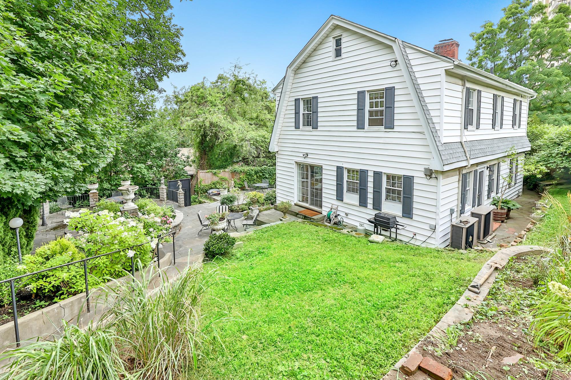 4-Bd. Dutch Center-Hall Colonial with Landscaped Garden & Wraparound Patio on Leafy Cul-de-Sac