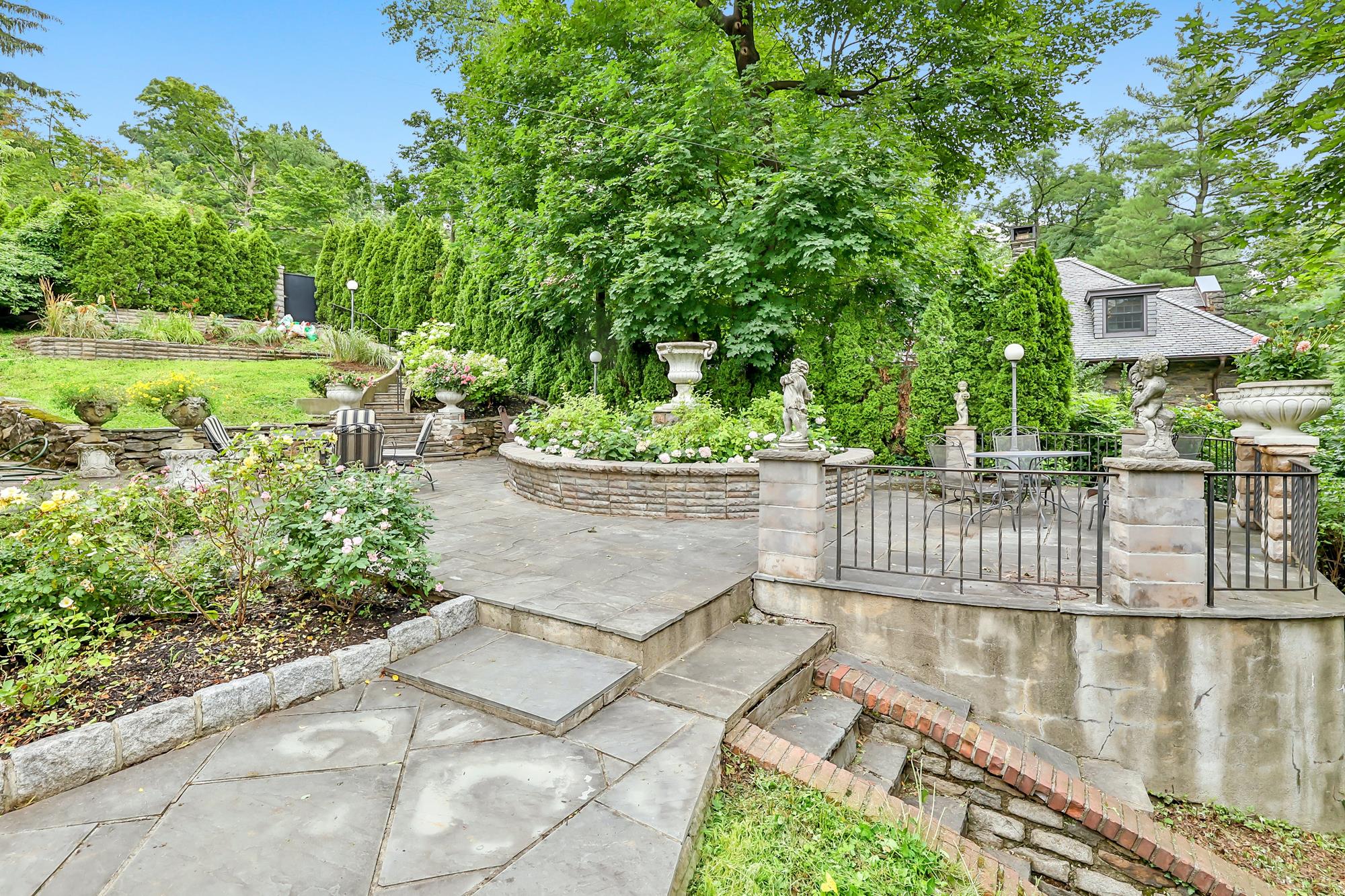 4-Bd. Dutch Center-Hall Colonial with Landscaped Garden & Wraparound Patio on Leafy Cul-de-Sac