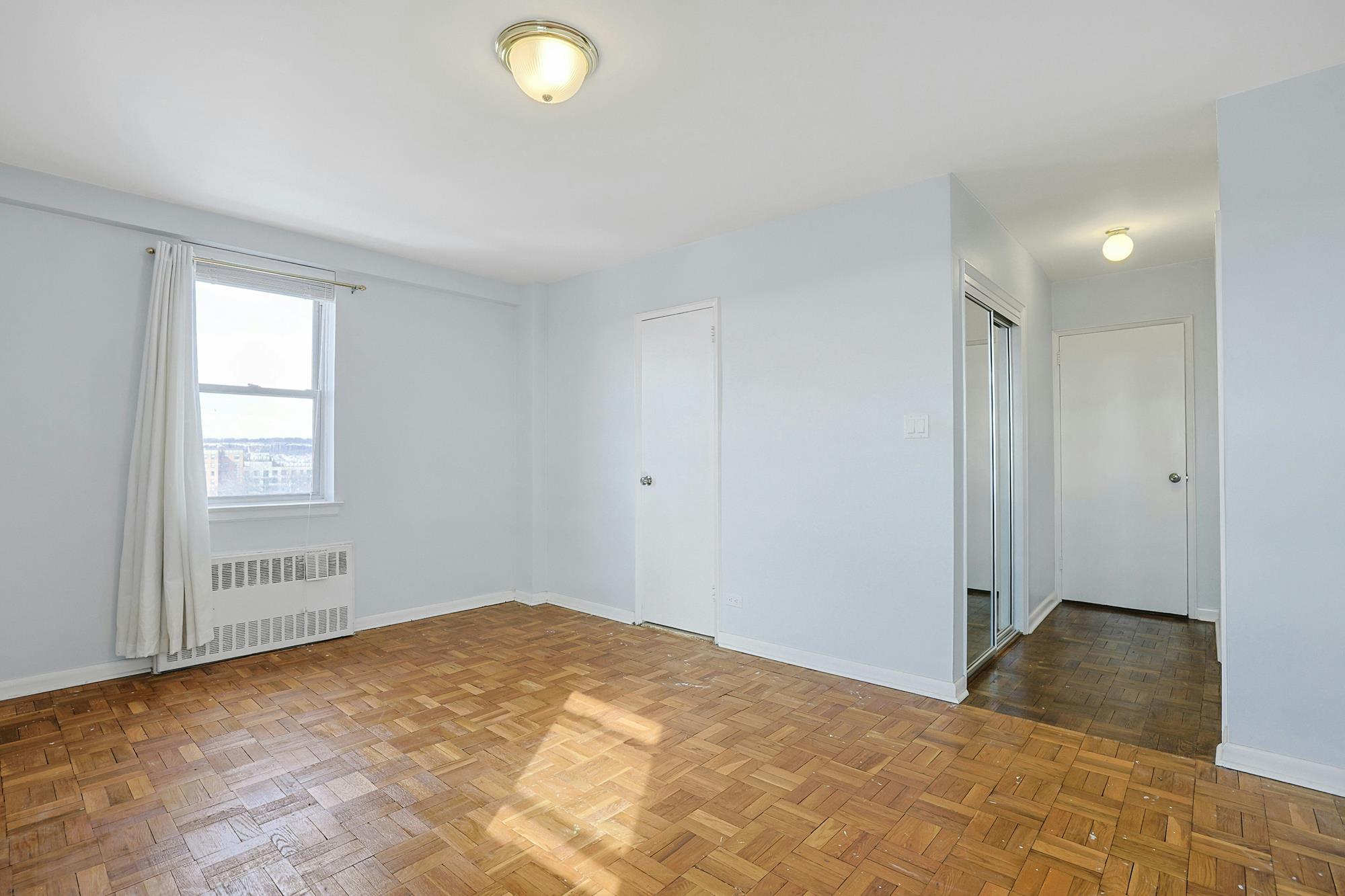 Sunny & Spacious 2-Bd. (Convertible 3-Bd.) Co-op with Balcony, Pool & 24-Hr. Doormen at The Edmond Lee