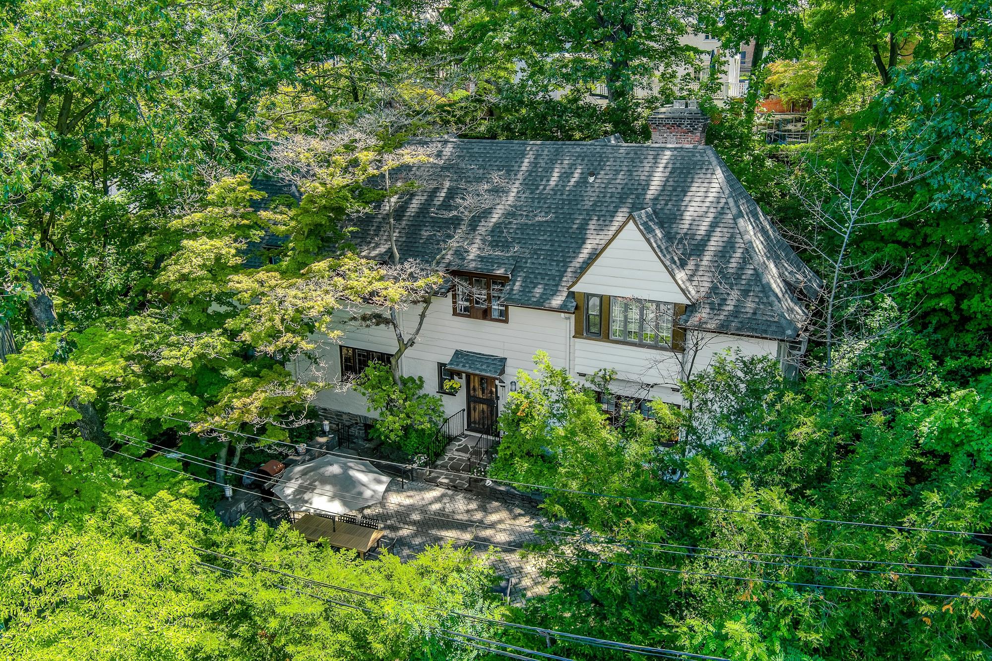 Classic & Spacious 5-Bd. Center-Hall Medieval Revival-Style House with Patio & Grassy Yard