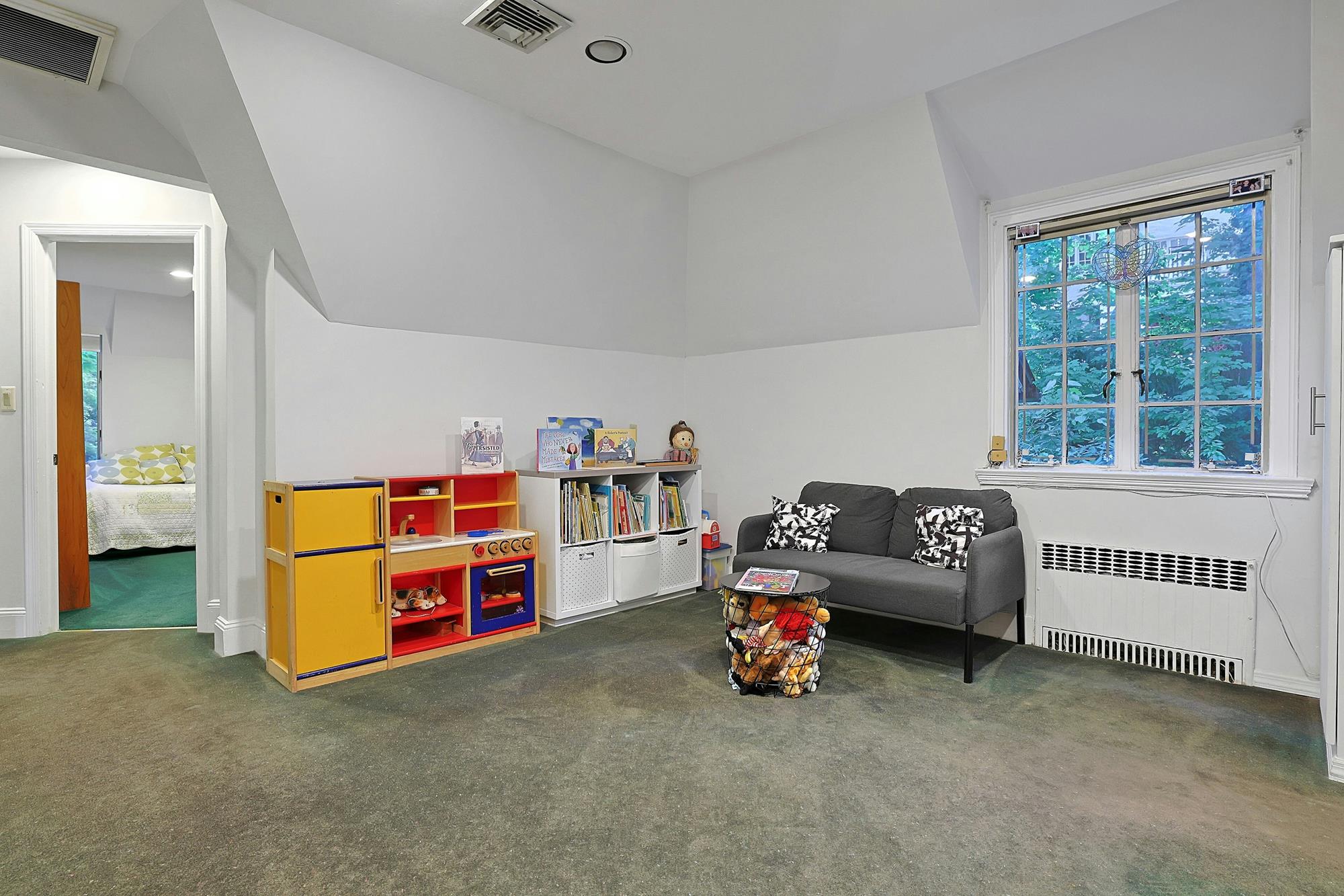 Classic & Spacious 5-Bd. Center-Hall Medieval Revival-Style House with Patio & Grassy Yard