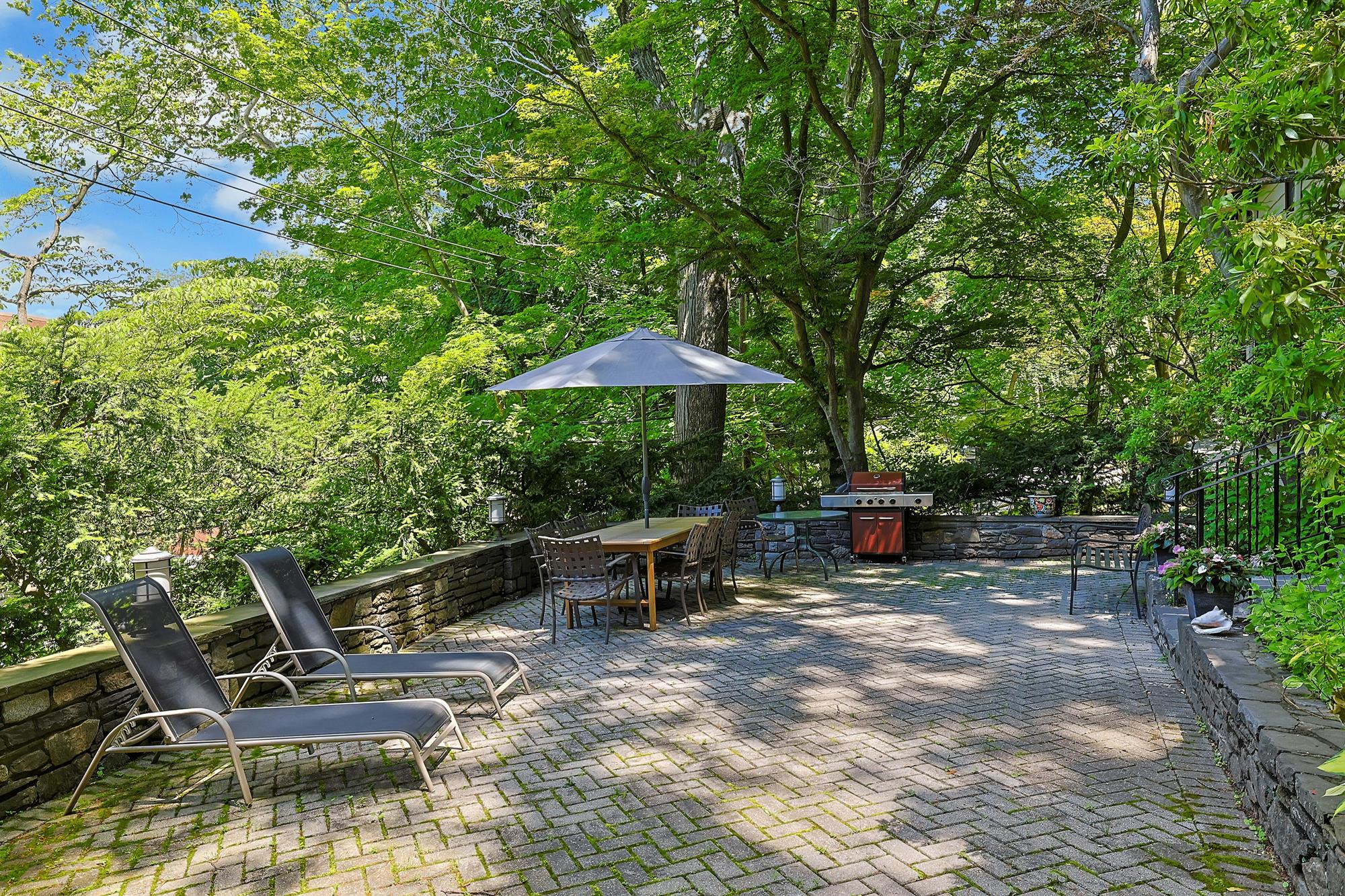 Classic & Spacious 5-Bd. Center-Hall Medieval Revival-Style House with Patio & Grassy Yard