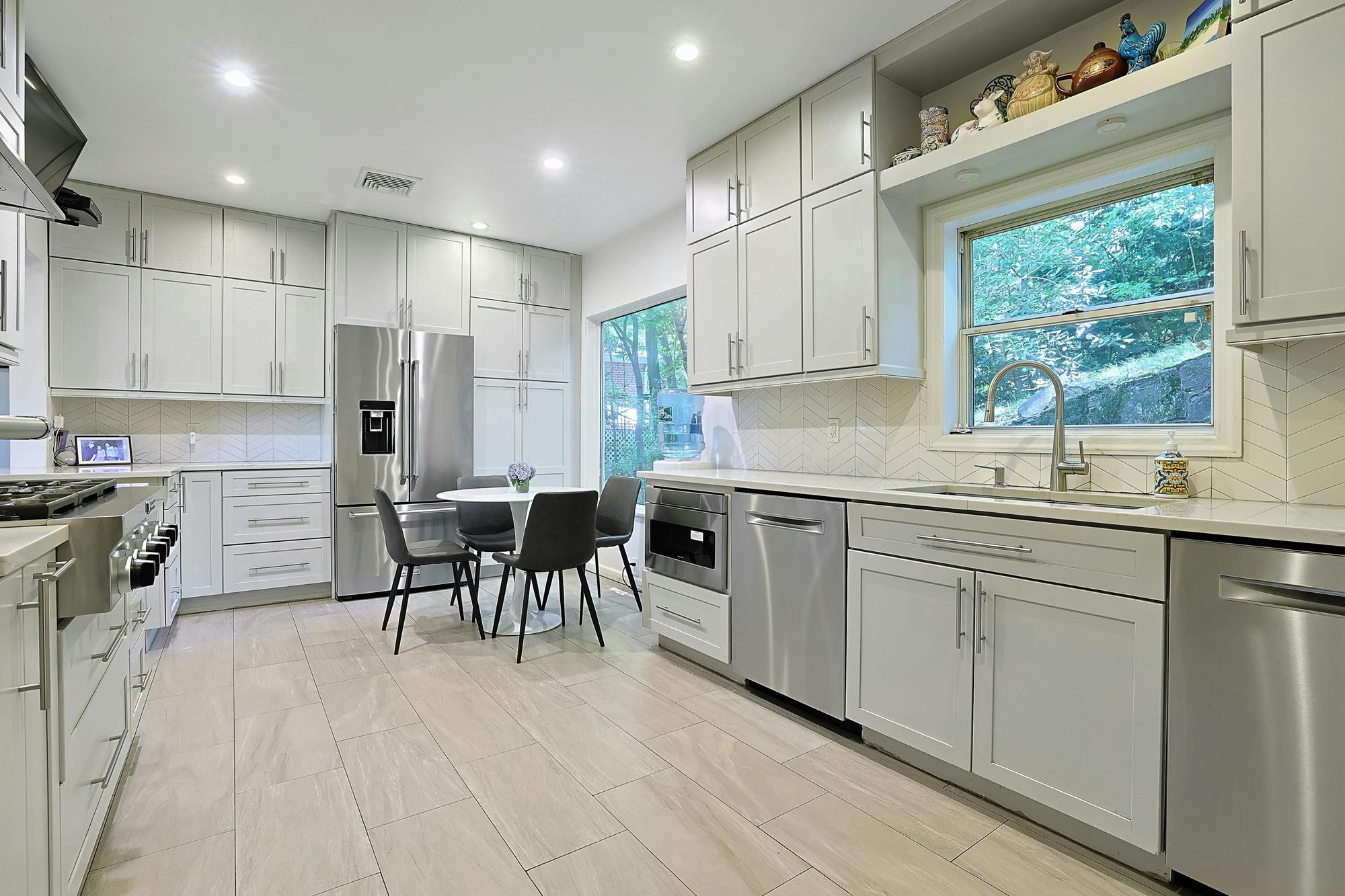 Classic & Spacious 5-Bd. Center-Hall Medieval Revival-Style House with Patio & Grassy Yard