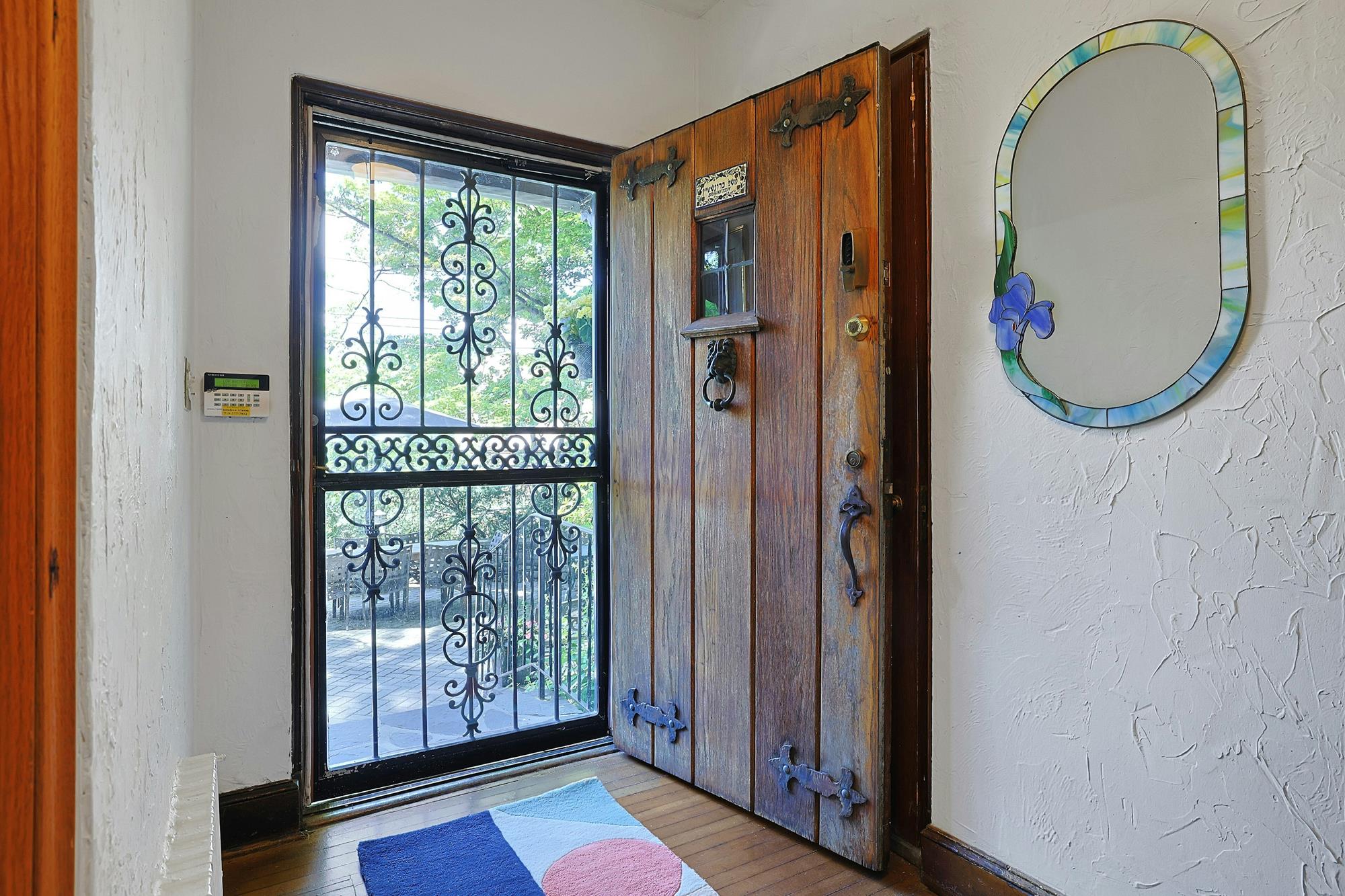Classic & Spacious 5-Bd. Center-Hall Medieval Revival-Style House with Patio & Grassy Yard