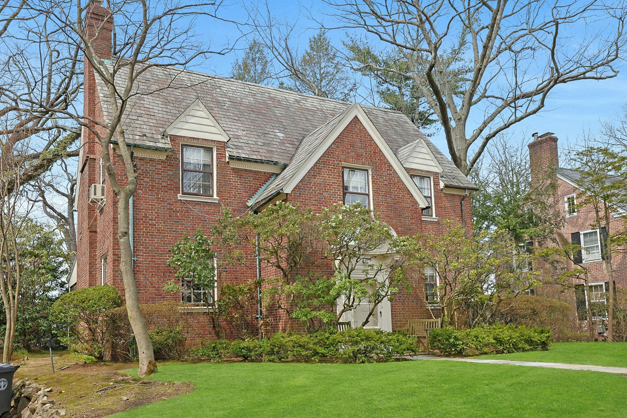 Classic & Spacious 4-Bd. Brick Center-Hall Colonial with Porch & Grassy Yards