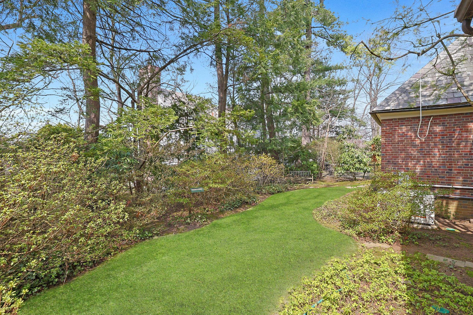Classic & Spacious 4-Bd. Brick Center-Hall Colonial with Porch & Grassy Yards