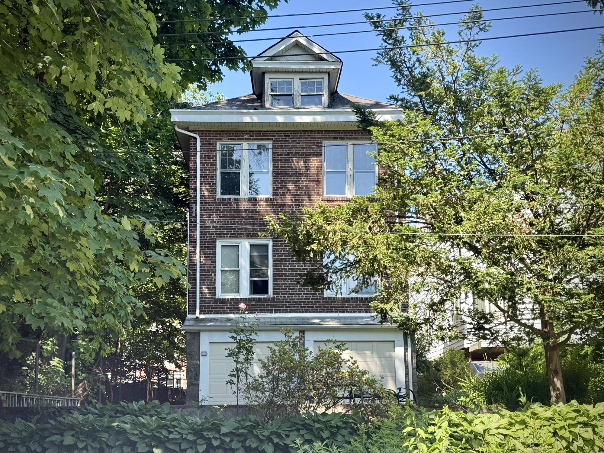 Three-Family Brick House with 2-Car Garage & Back Garden