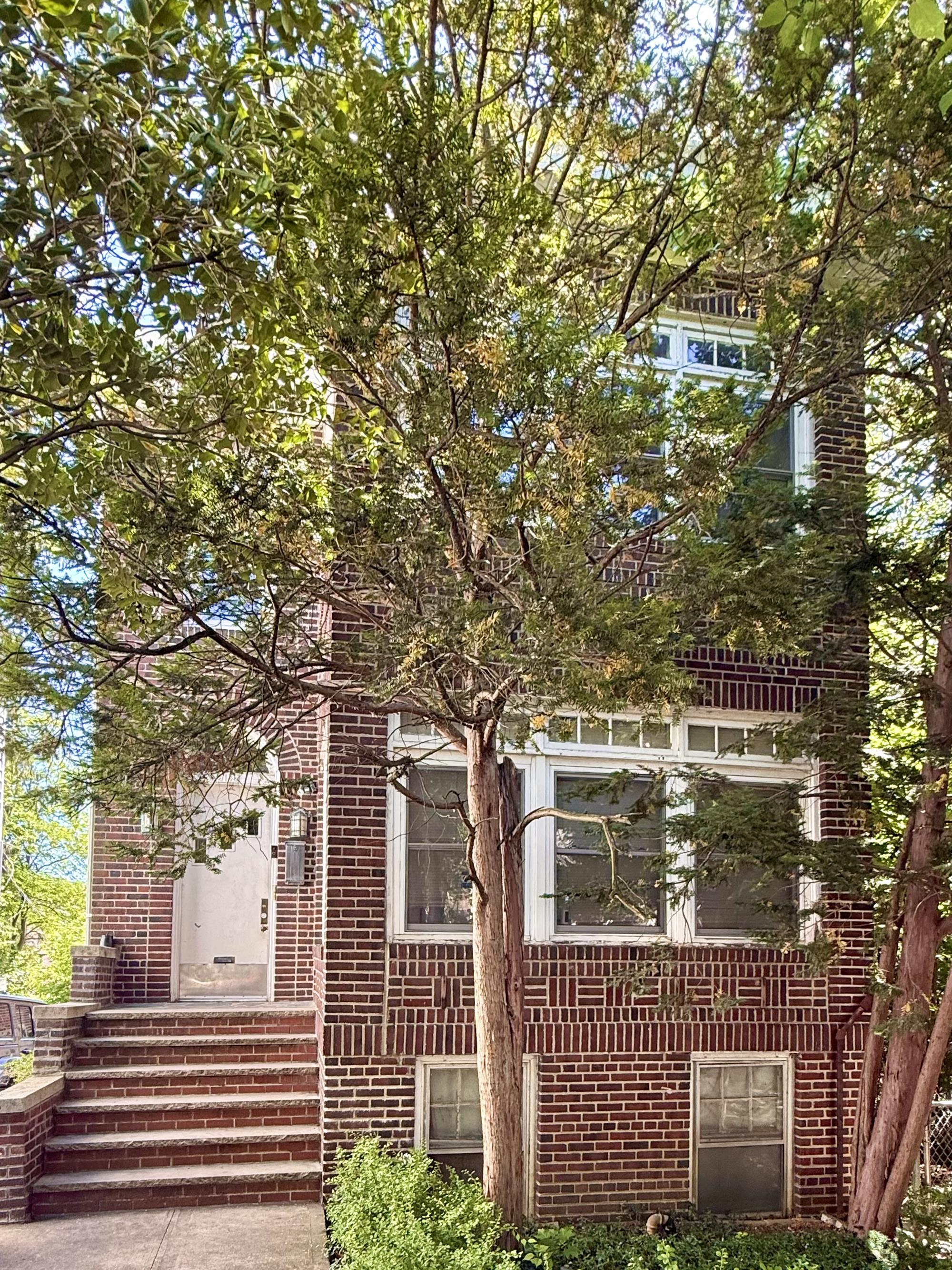 Three-Family Brick House with 2-Car Garage & Back Garden