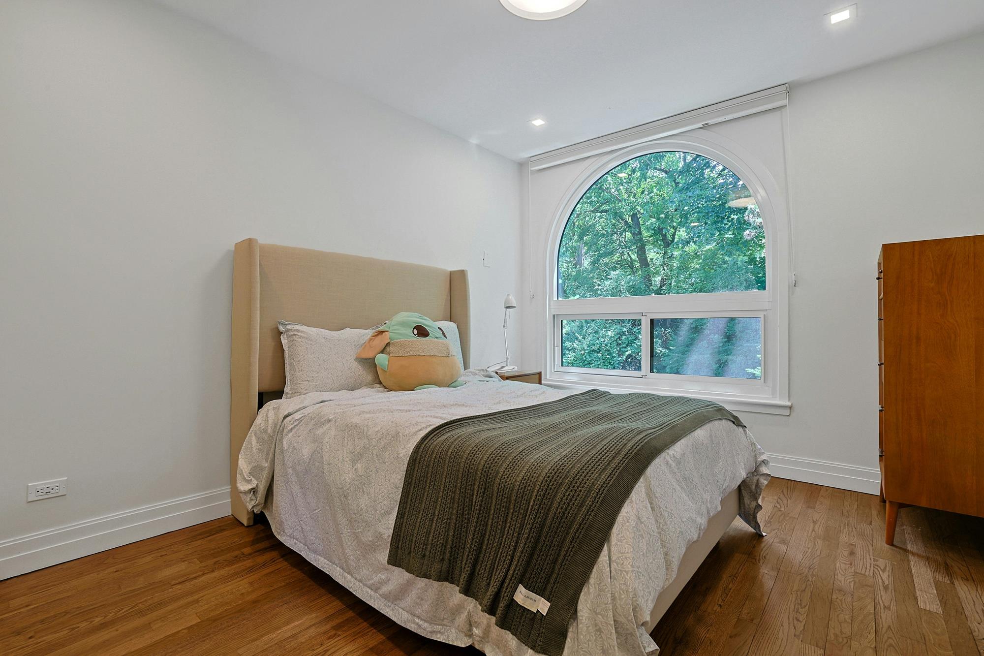 Spacious & Newly Renovated Triplex Townhouse with Luxe Condo Amenities, Seasonal Water Views, Deck, Garden & 2 Parking Spaces on Cul-de-Sac