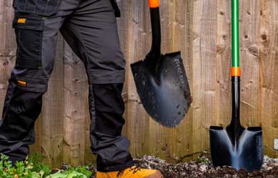 ManÕs leg next to two shovels