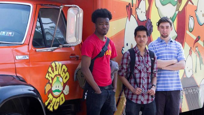 Reggie Hawkins, Sarunyoo Tohchoodee and William Shanley founded Legit Delivery, which delivers food from trucks on Main Campus to students. | Luis fernando rodriguez TTN Reggie Hawkins, Sarunyoo Tohchoodee and William Shanley founded Legit Delivery, which delivers food from trucks on Main Campus to students. | LUIS FERNANDO RODRIGUEZ / TTN
