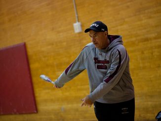 Softball coach Joe DiPietro helps his team prepare for the final season the program will compete in before it is slated to be cut in July. | Alex Udowenko TTN
