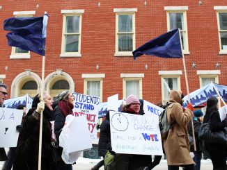Adjunct professors chant, “Let us vote,” as they march down Liacouras Walk on Feb. 23. Pending a March 19 hearing with the Pennsylvania Labor Relations Board, adjuncts are demanding a vote for or against unionization. | Kara Milstein TTN