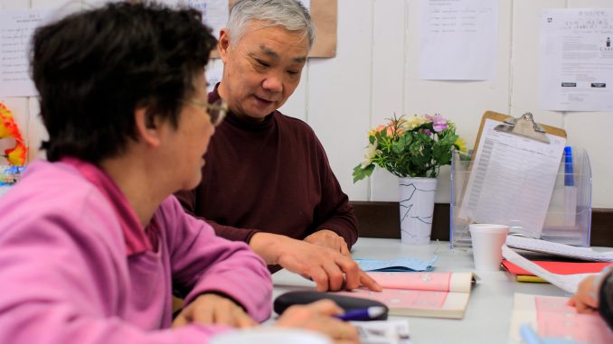 Muoi Thai, 68 (left), and Jiang Bogun, 65, practice English at the Coffee Cup Branch of the Philadelphia Senior Center on March 19. The two are students in the IGC’s Project SHINE program. | Harrison Brink TTN Muoi Thai, 68 (left), and Jiang Bogun, 65, practice English at the Coffee Cup Branch of the Philadelphia Senior Center on March 19. The two are students in the IGC’s Project SHINE program. | Harrison Brink TTN