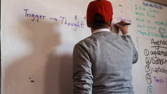 Andrew Spiers, a therapist at Morris Home, discusses triggers that can lead to relapse during a group therapy session. | Aaron Windhorst TTN Andrew Spiers, a therapist at Morris Home, discusses triggers that can lead to relapse during a group therapy session. | Aaron Windhorst TTN