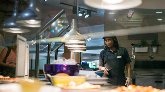 Sodexo_News_9.1_MargoReed05 Arnessa Smith works at the Saffron Grill, a Halal station that was added to the Valaida S. Walker Food Court this summer. | Margo Reed TTN