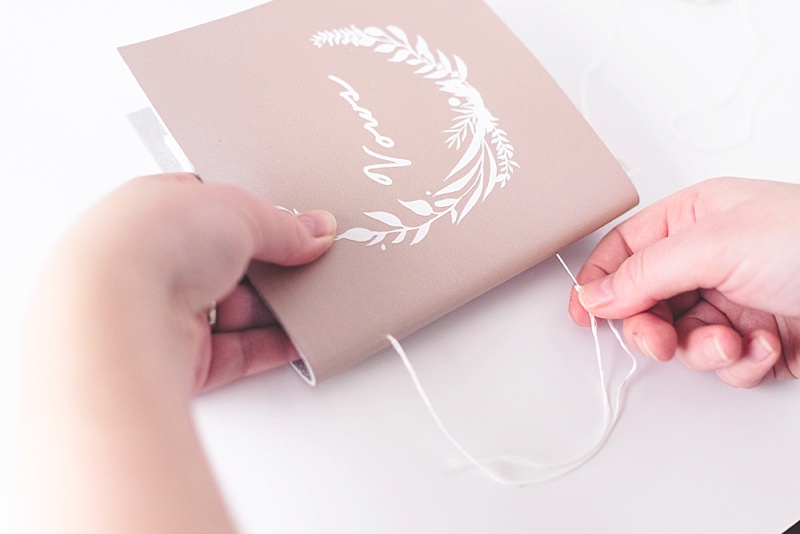 Rose gold wedding vow book with long stitch binding