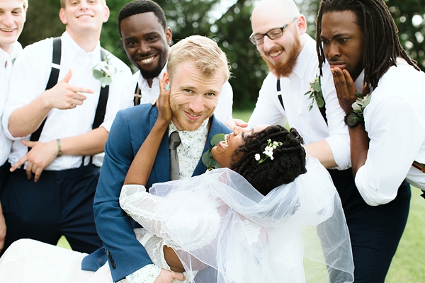 Adorable bride and groom moment with their wedding party