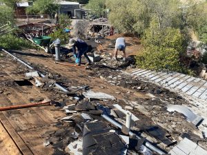 tearing off an old roof in Tucson