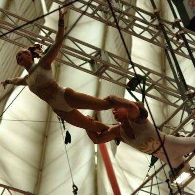 Rebecca performing flying trapeze in the Gamma Phi Circus at Illinois State University.