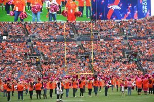 Crowd cheers as survivors take to the field during halftime of the Oct. 9 game.