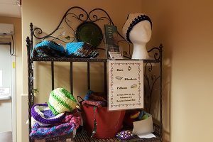 A stack of hats for cancer patients.
