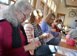 Janet Slagle and Randine Nelson, both of Fort Collins are shown knitting at the Knit for a Cause Knit-A-Thon in Fort Collins.