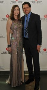Becky and Jeremiah Pomerleau pose in formal attire at an event promoting the American Heart Association.