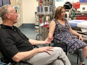 Leann Krayenhagen, right, with her husband, Scot, by her side, tells her story to media recently of her motorcycle accident and how, because people nearby new how to stop the bleeding in her leg, saved her life, Krayenhagen has been an advocate for UCHealth's recent efforts to train civilans in Stop the Bleed skills. Photo by Kelly Tracer, UCHealth.