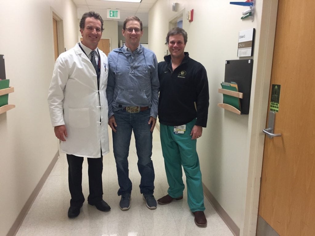 Archie Chant, center, with two of his doctors, Craig Hogan, left, and Jason Stoneback, right.