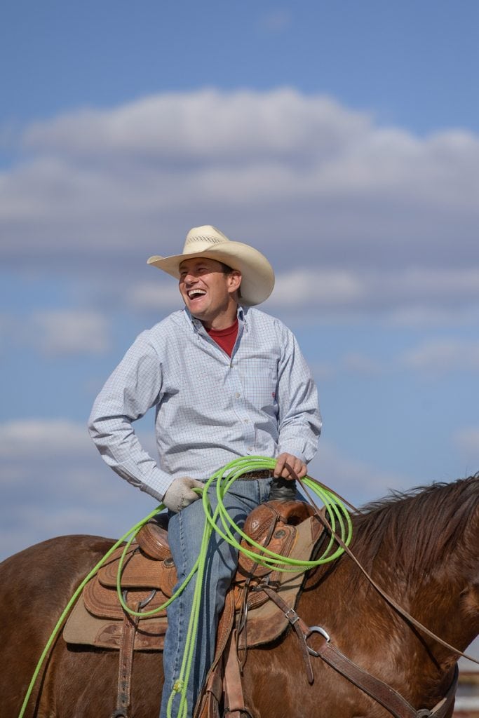Rancher Archie Chant smiles as he sits on his horse. Chant survived a head-on collision that nearly cost him his leg and his life. Now, he's riding, roping and ranching again.