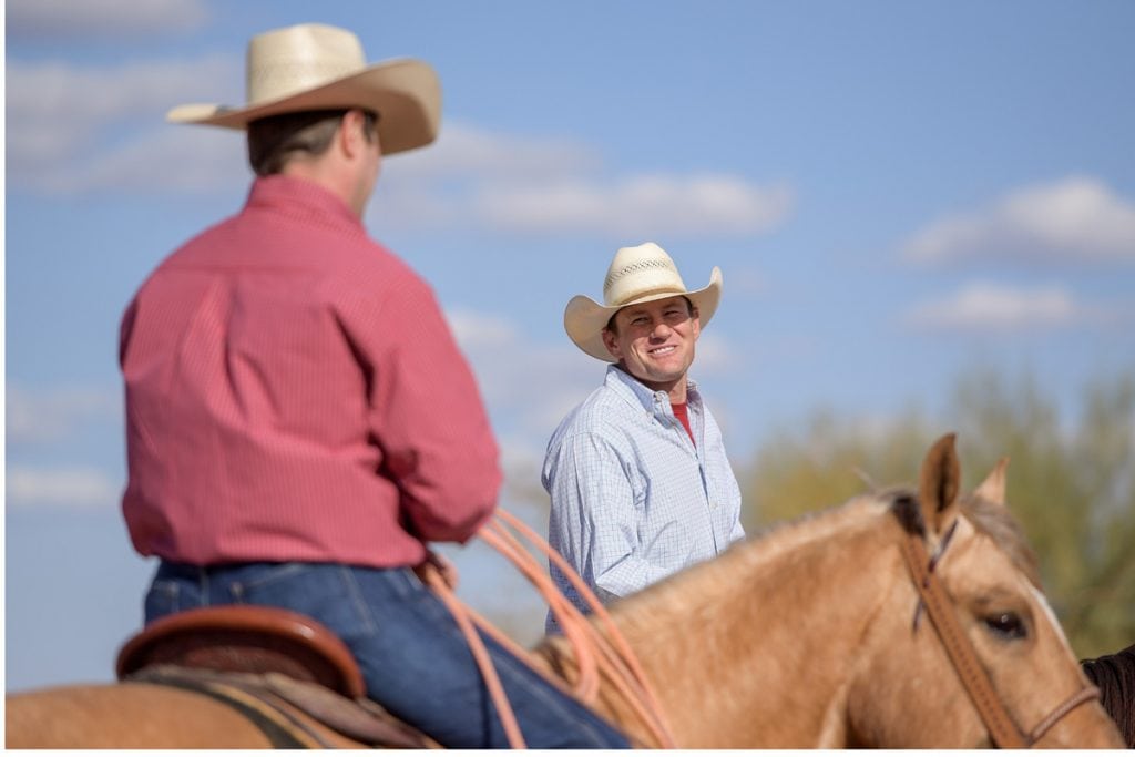Jason Stoneback wears his cowboy hat and is on his horse. In the foreground is his doctor, Jason Stoneback, who is also on his horse and wearing a cowboy hat.