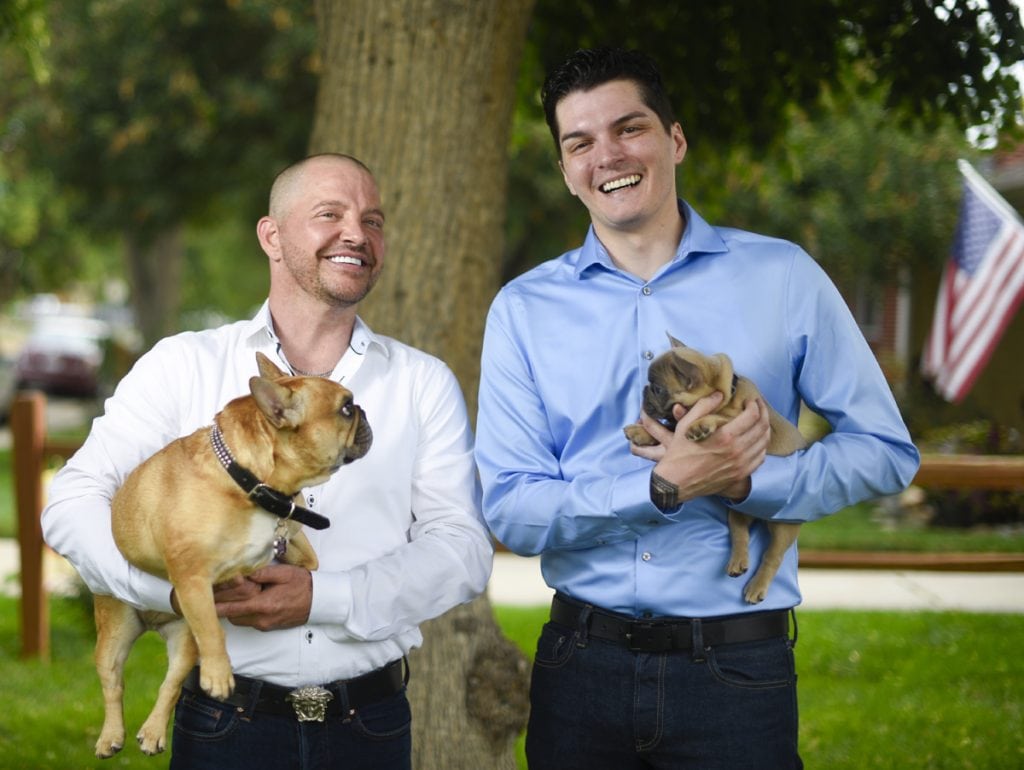 Kenley Erskine, left, and Stephen Estrada, right, with two of their dogs before their wedding on Aug. 1. Stephen holds the puppy, whose name is Mr. Jimmy Chews. Kenley holds Gretl. Photo by Cyrus McCrimmon for UCHealth Today.
