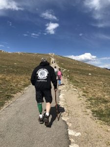 Jesse Adams walks a trail