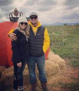 Devyn Brinkerhoff and her fiance, Caleb Olsen, pose together outside.