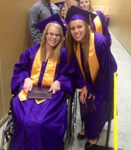 Devyn poses in her cap and gown at her high school graduation.