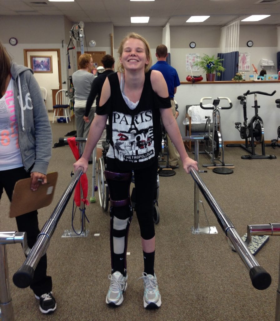 Devyn Brinkerhoff smiles as she learns to walk again.