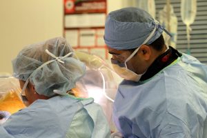 close up of two surgeons in the operating room