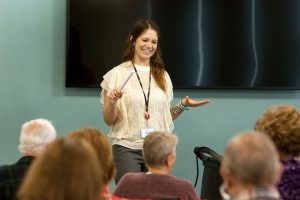 women talking to audience during longmont seniors program
