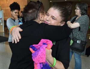 Ruth Sena hugs Sara Millard.